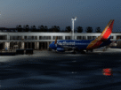 Vista aérea do cenário XWind Long Beach KLGB no MSFS 2024 ao pôr do sol