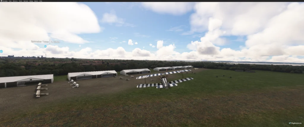 Vista geral do campo gramado, hangares e aeronaves do Grange Aerodrome 1917 no MSFS