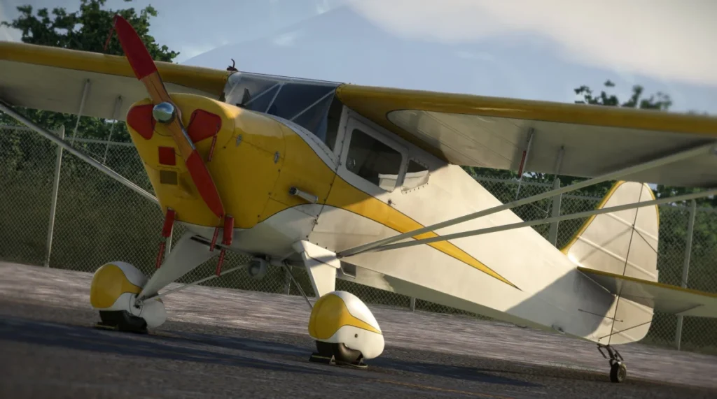 Taylorcraft BC-12D amarelo estacionado no Microsoft Flight Simulator