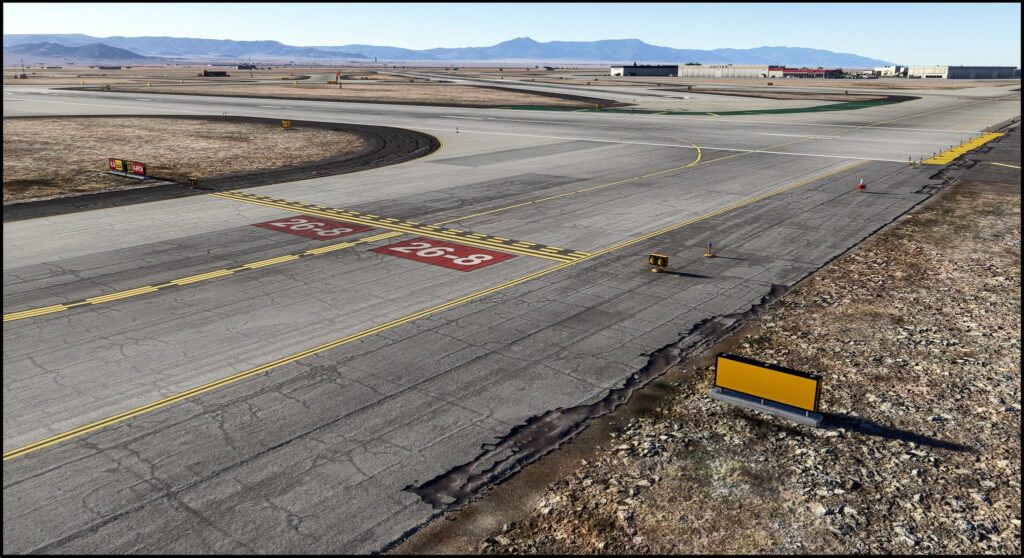 Sinalização de taxiway e entorno desértico no cenário PacSim Albuquerque para MSFS