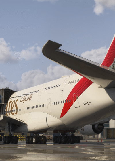 iniBuilds London Heathrow para MSFS 2024 com múltiplas jetways conectadas a uma aeronave em gate