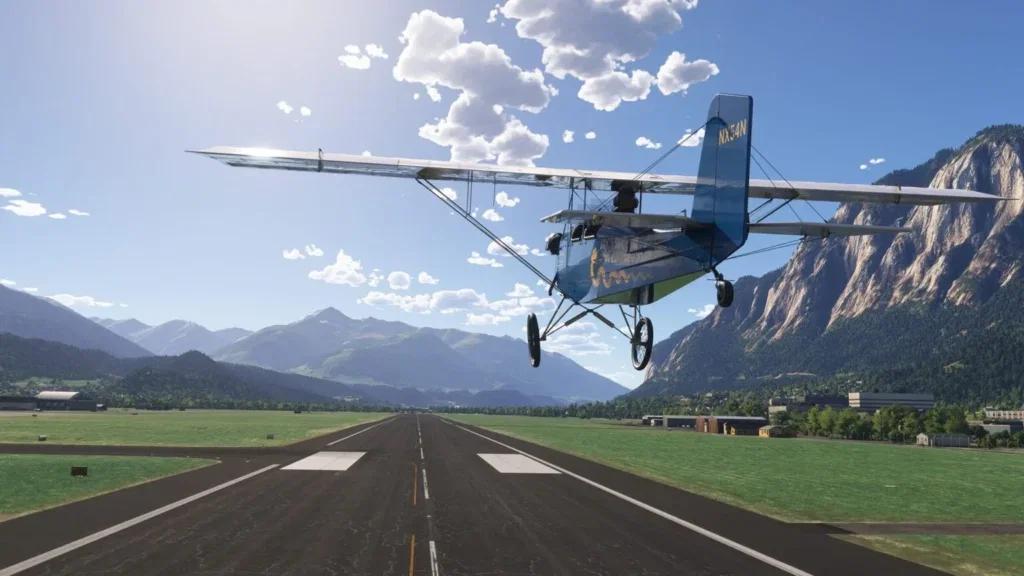 Pietenpol Air Camper sobre pista com montanhas ao fundo